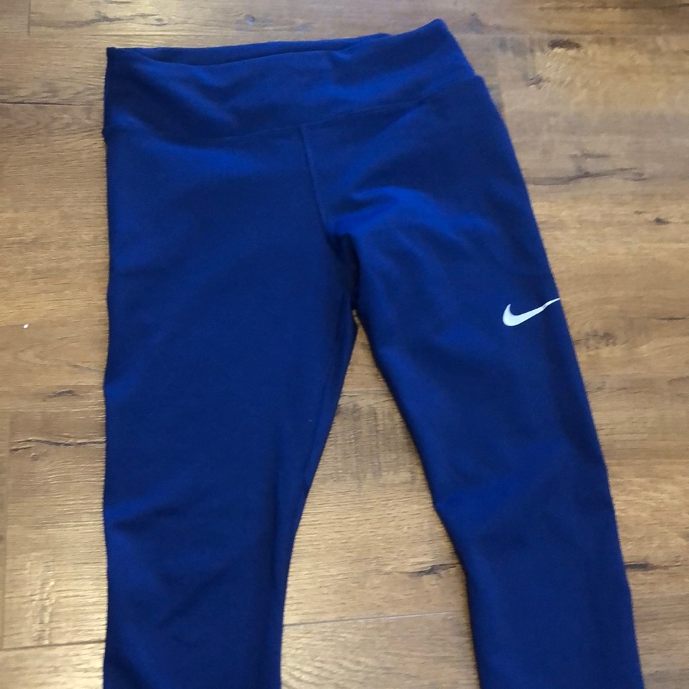 blue nike workout leggings with mesh panels